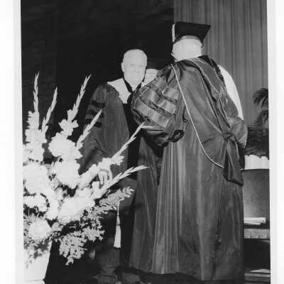 J. Joseph Bluett, S.J., conferring honorary degree during 1958 graduation/commencement ceremony.