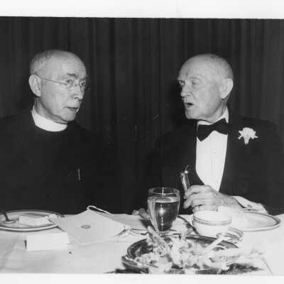 Jesuit and guest during dinner banquet held in Field House as part of centennial anniversary celebration.