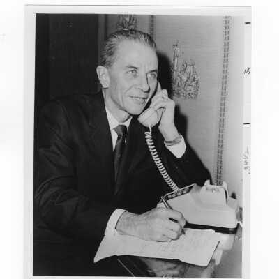 Charles Kraft, chairman of annual giving campaing of alumni association, talking on telephone, January 18, 1965.