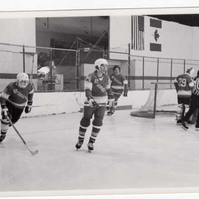 Men's ice hockey team in game.