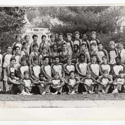 Group photo of men's track team with Coaches Kevin Quinn, Mike Diorka, Jim Van Blunk, 1985.
