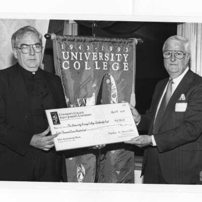 Nicholas S. Rashford, S.J., and Charles D. Brennan at scholarship fundraising event for University College during 50th anniversary.