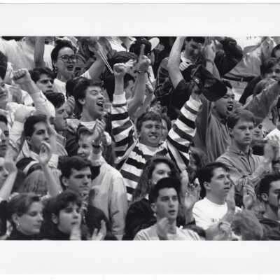 Students cheering at Men's Basketball game
