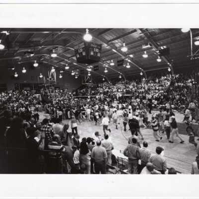 Students celebrating after Men's Basketball victory in Fieldhouse