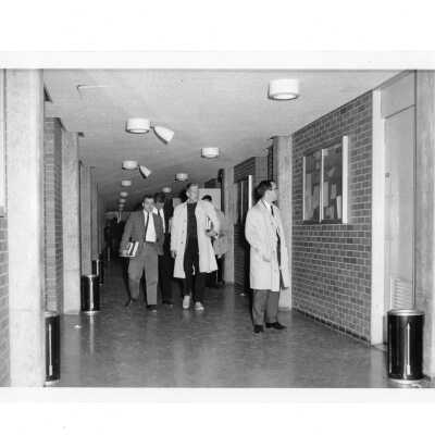 Students walking in Bellarmine hallway.