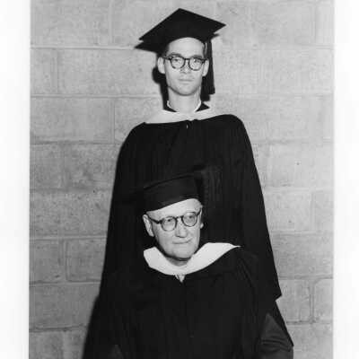 Graduating student, Gregory Heine, with his alumnus father, H. Eugene Heine, class of 1908 at 1954 graduation/commencement ceremony.
