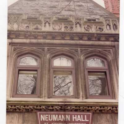 View of front of Wolfington Center (formerly Gest Estate, Neumann Hall) with Neumann Hall sign.