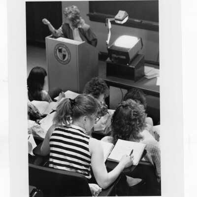 Students listening to lecture and taking notes.