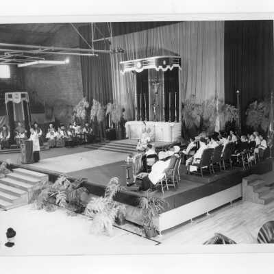 View of pontifical mass for centennial celebration held in Field House with Robert J. Gannon, S.J. giving sermon.