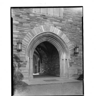 Exterior view of central arch of Barbelin building with gargoyles.
