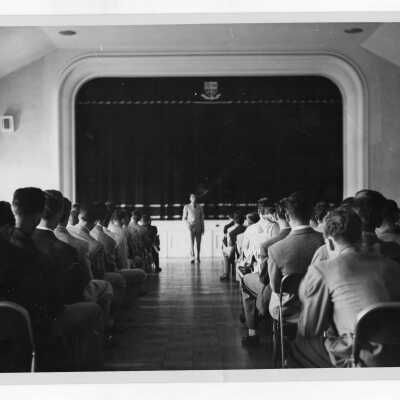 Students listening to Ray Gehrig, ROTC commander in Flanigan Auditorium.
