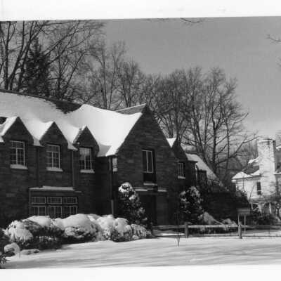 Front view of Saint Thomas Hall in the snow.