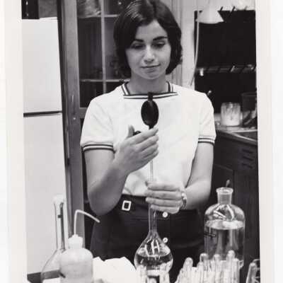 Biology student, Rosemary DePaoli, working on Crown Gall project in science laboratory, August 1975.