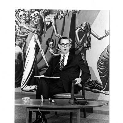 James J. O'Connor of Academy of Food Marketing in Villiger (later Post) holds press conference in fron of Theology of Hunger Fresco.