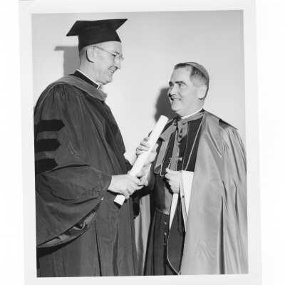 William F. Maloney, S.J., with honorary degree recipient, Bishop Gerald McDevitt, during 1963 graduation/commencement.