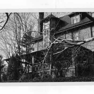 Exterior side view of Simpson Hall with porch.