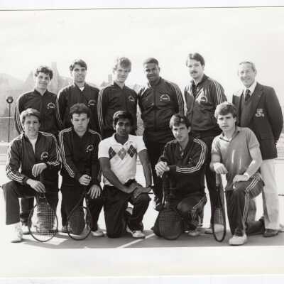 Group photo of 1985 men's tennis team with Coach Al Laveson.