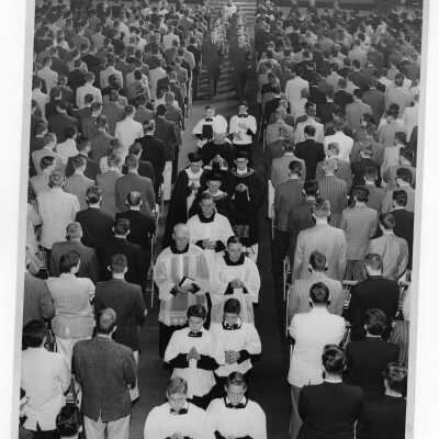 Recessional following Mass in Field House, c. 1957 with Bishop McSorley (?) and J. Joseph Bluett, S.J.