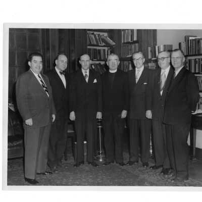 Reunion of New York alumni from class of 1925, November 30, 1951. Includes Joseph (Archie) McCormick, John F. Ryan, William Drislane, Joseph J. Hogan, S.J., Drew McNichol, Fred Coll, Joseph P. Tully.
