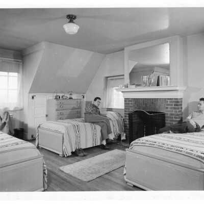 Two students in dormitory room in student residence.
