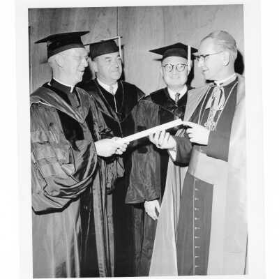J. Joseph Bluett, S.J., with honorary degree recipients Augustus Flood, John Cardinal Krol, and Gerald Flood during 1961 graduation/commencement.