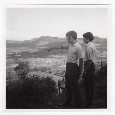Two students standing on hilltop overlooking valley in Colombia during Latin American Studies Institute Summer Service Project, summer 1970.