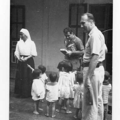 U.S. soldier with Vietnamese children and Vietnamese nun, Vietnam Orphanage project.