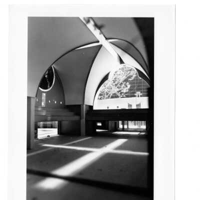 Interior view fo Chapel of Saint Joseph with daylight reflecting cross on floor.