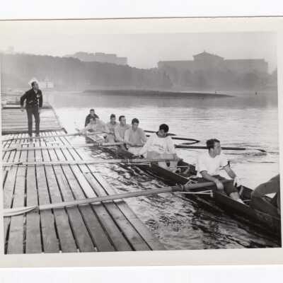 Men's crew/rowing team at dock of Boathouse Row on Schuylkill River.