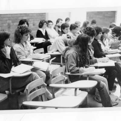 Students sitting in classroom listening to lecture.