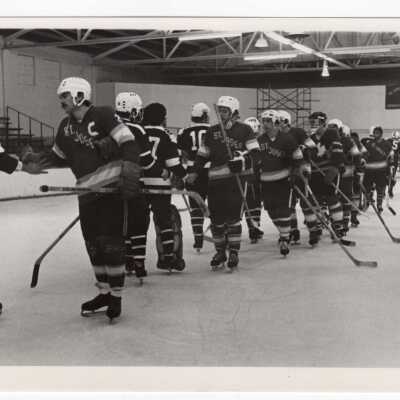 Men's ice hockey team in game.