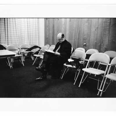 Faculty member or speaker preparing for 1971 graduation/commencement ceremony (?).
