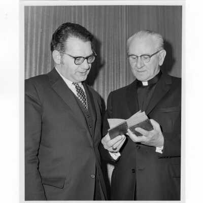 Rabbi Marc Tanenbaum and Terrence Toland, S.J., examining ancient book during Third Institute on Catholic -Jewish Relations, March 2, 1971.