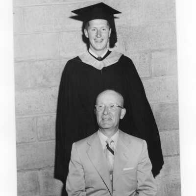 Graduating student, Thomas S. McKeon, with his alumnus father, (Edwin A. McKeon, class of 1915?) at 1954 graduation/commencement.