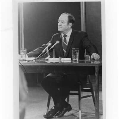 Vice President Hubert Humphrey seated at table speaking during his visit to SJC campus, January 27, 1970.