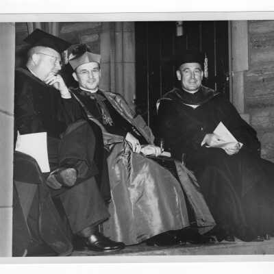 John J. Long, S.J.; Bishop Carroll Mc Cormick, and Dr. Distler at 1947 graduation/commencement ceremony.
