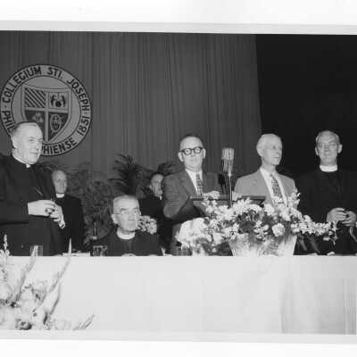 Testimonial dinner for Joseph S. Hogan, S.J., May 26, 1957, with Bisohp Joseph McShea, Daniel Dougherty, and J. Joseph Bluett, S.J.