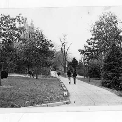 Students walking with Barbelin Tower is distance.