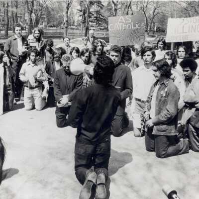 Father Tony Capizzi and Father Joseph Daoust lead student protest against Vietnam War on City Avenue.