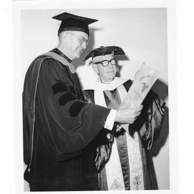 William F. Maloney, S.J., with honorary degree recipient, Bishop Fred Pierce Corson, during October 1963 graduation/commencement.