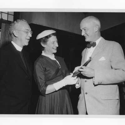 Dr. John H. Gibbon, Jr., showing Shaffrey award medal to J. Joseph Bluett, S.J. and Mrs. John H. Gibbon, April 7, 1957.