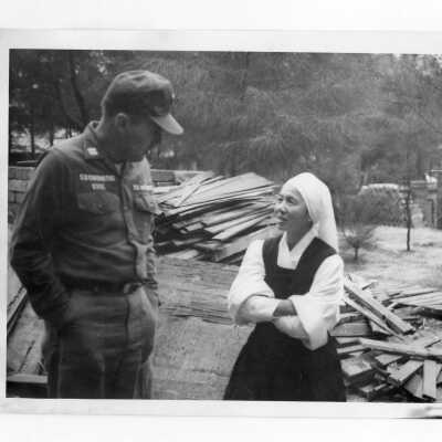 U.S. soldier with Vietnamese nun, Vietnam Orphanage project.