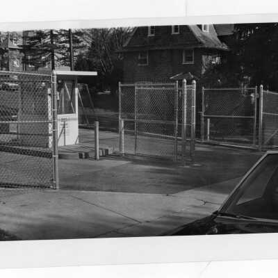 Entrance gate and kiosk to parking lot at 54th Street and Overbrook Avenue.