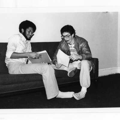 Two students studying in lounge area.
