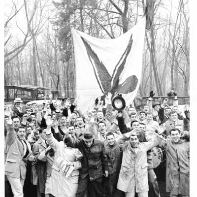 Men's Basketball, students outside celebrating victory.