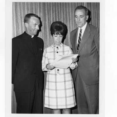 Pax Romana's 20th World Plenary Assembly meets at Saint Joseph's College, August 1968. Terrence Toland, S.J., and Joaquin Ruiz-Gimenez meet with Mrs. Maria Cruz, acting President of OPEN, about public housing needs.