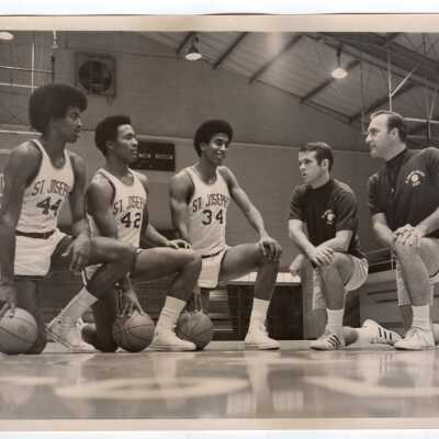 Men's Basketball, three players with two coaches.