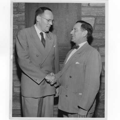 Alumni association president, Francis Lammer, greeting Frank Lalley, chairman of the annual giving drive, June 2, 1955.