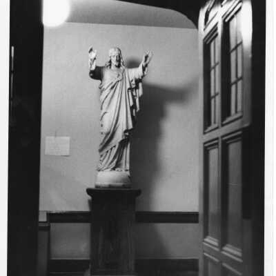 Interior view of hallway in Barbelin with statue of Jesus.