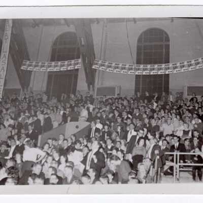 Men's Basketball, student crowd watching game.